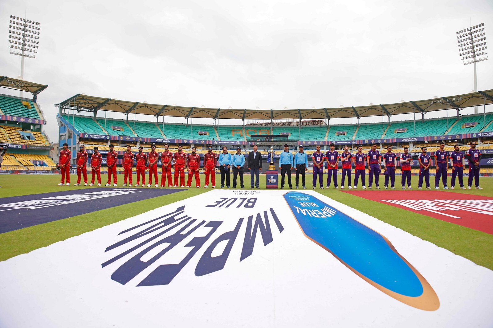 Players and match officials with the cup during Match 3 of the APL T20 between Barak Legends and Nagaon Rangers at ACA Stadium, Barsapara, Guwahati, India, on August 2, 2026.

Photo by R.Param / CREIMAS